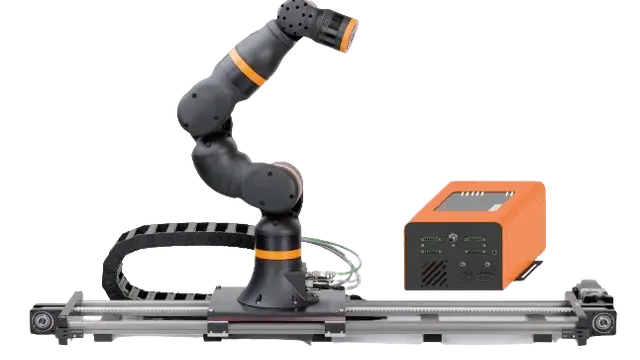 Collaborative robotic arm with orange control unit on linear rail system for industrial automation