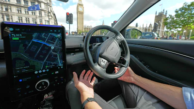 An Uber driver has his hands ready for intervention as he sits in an autonomous car in London, Tuesday, Sept. 1, 2026 as Uber officially launches the first hailable autonomous cabs in London.
