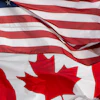The flags of Canada and the United States fly over a stadium in Ottawa, Saturday, Sept. 12, 2026.