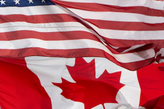 The flags of Canada and the United States fly over a stadium in Ottawa, Saturday, Sept. 12, 2026.