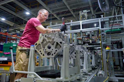 A worker at GM’s Flint Engine Operations, where the all-new Gen-6 5.7L and 6.6L V8s are assembled.