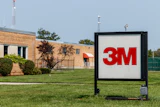3M company logo on outdoor sign in front of brick facility building