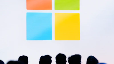 Microsoft logo featuring four colored squares in orange, green, blue, and yellow arranged in a grid pattern
