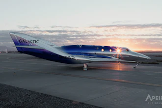 Virgin Galactic SpaceShipTwo aircraft on runway at sunset with illuminated cabin windows