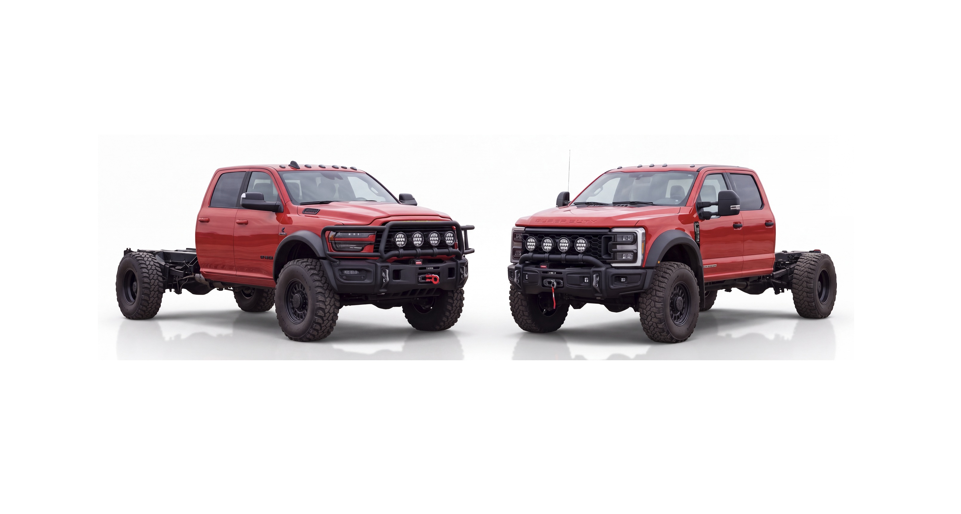 Two red lifted pickup trucks with custom front bumpers and roof lights displayed side by side