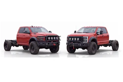 Two red lifted pickup trucks with custom front bumpers and roof lights displayed side by side