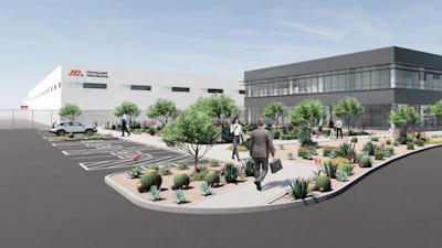 Architectural rendering of modern office and industrial facility with white and gray buildings, desert landscaping, parking area, and people in courtyard.