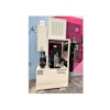 Booster Trolley industrial machine with cream and black components displayed in showroom with pink wall backdrop