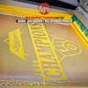 Whirlpool branded appliance component with yellow protective packaging in manufacturing facility