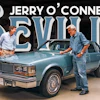Jerry O'Connell and a man examine a blue classic Oldsmobile Cutlass in a showroom