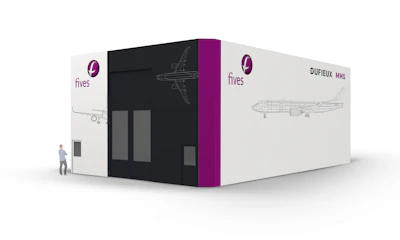 Fives industrial exhibition booth featuring aircraft design graphics and purple branding accents