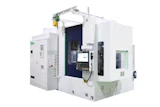 White industrial CNC machining center with dark blue interior cavity and control panel