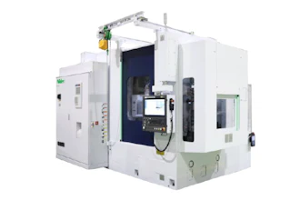 White industrial CNC machining center with dark blue interior cavity and control panel