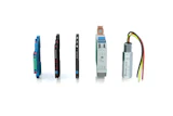 Five industrial electronic sensors and measurement devices displayed in a product lineup arrangement