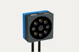 SICK 3D camera sensor with blue and gray housing and circular lens array with gold contact points