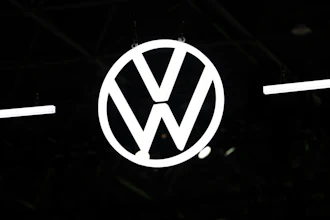 Volkswagen logo emblem illuminated against dark background